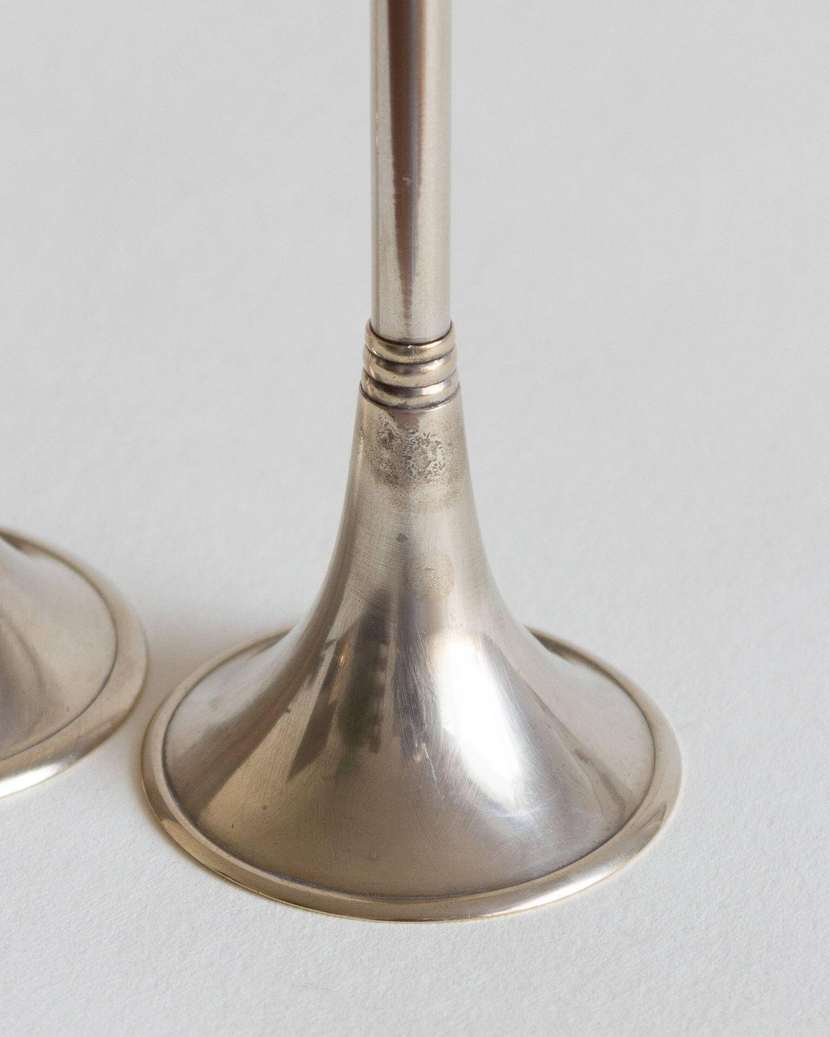 Duo of silver-plated brass candlesticks, 1950s/1960s