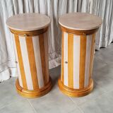 A pair of distressed bedside tables.