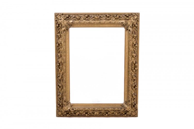 Antique mirror in richly decorated frame, France.