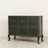 Green chest of drawers with floral decorations