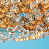 Floral wall light in gilded brass and cut glass by Palwa, Germany, 1970s.