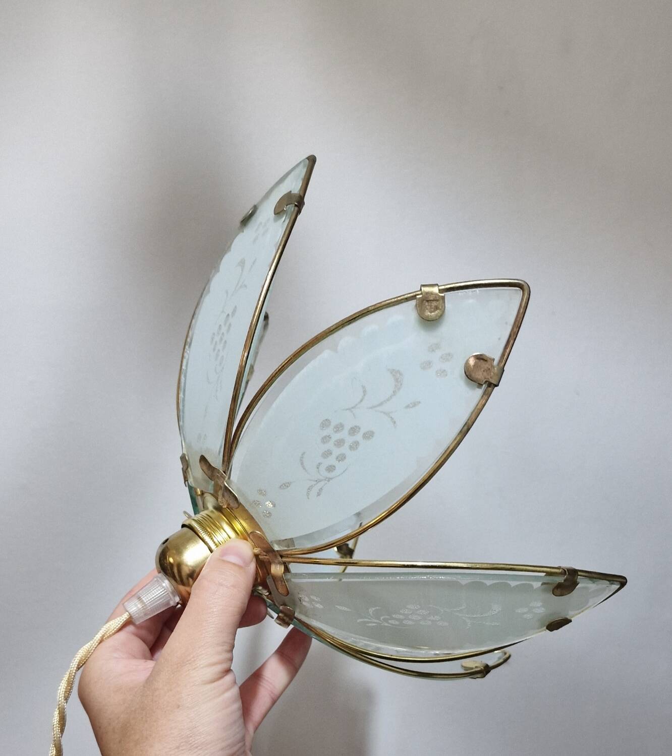 Glass flower rimmed with brass