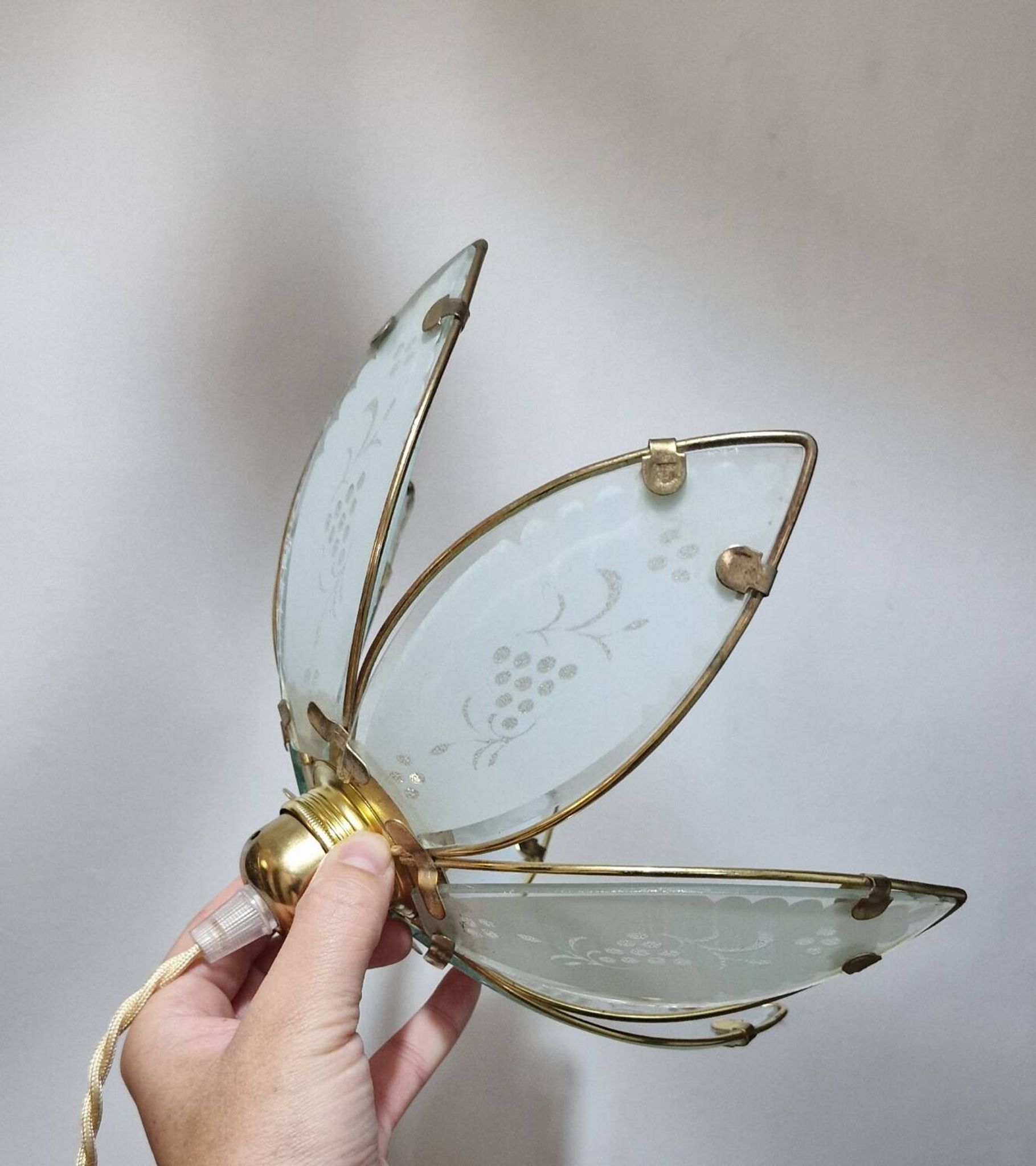 Glass flower rimmed with brass