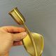A set of "tulip" wall lamps in golden colored metal. Danish 1970-80s