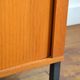 Storage cabinet with sliding curtain shutter 1950s