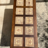 Vintage 60s coffee table with tile decoration of birds and flowers.