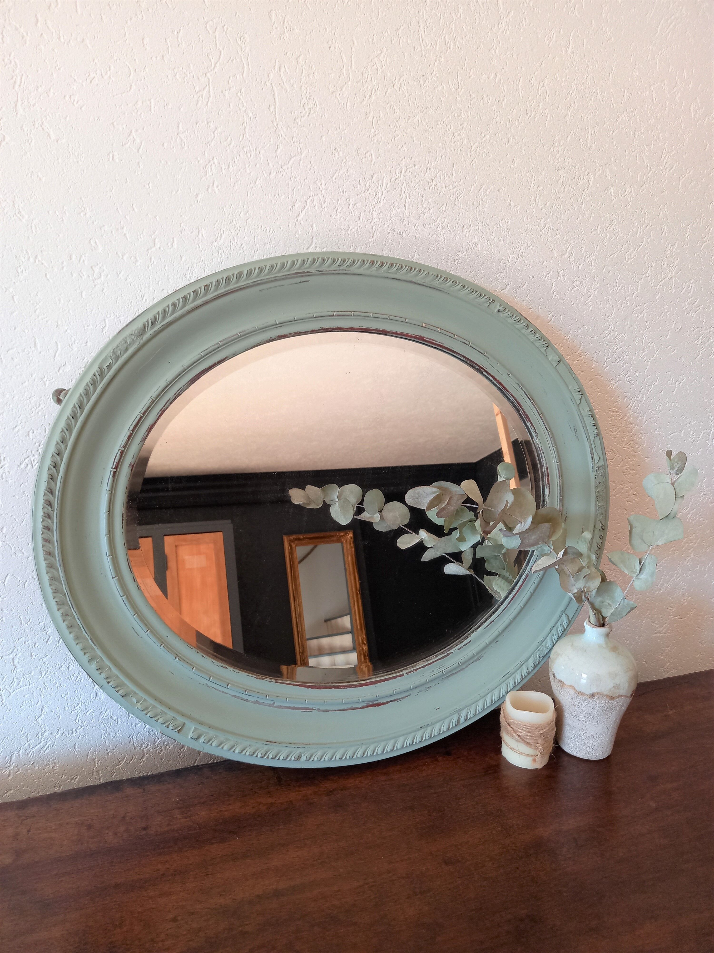 Green oval mirror