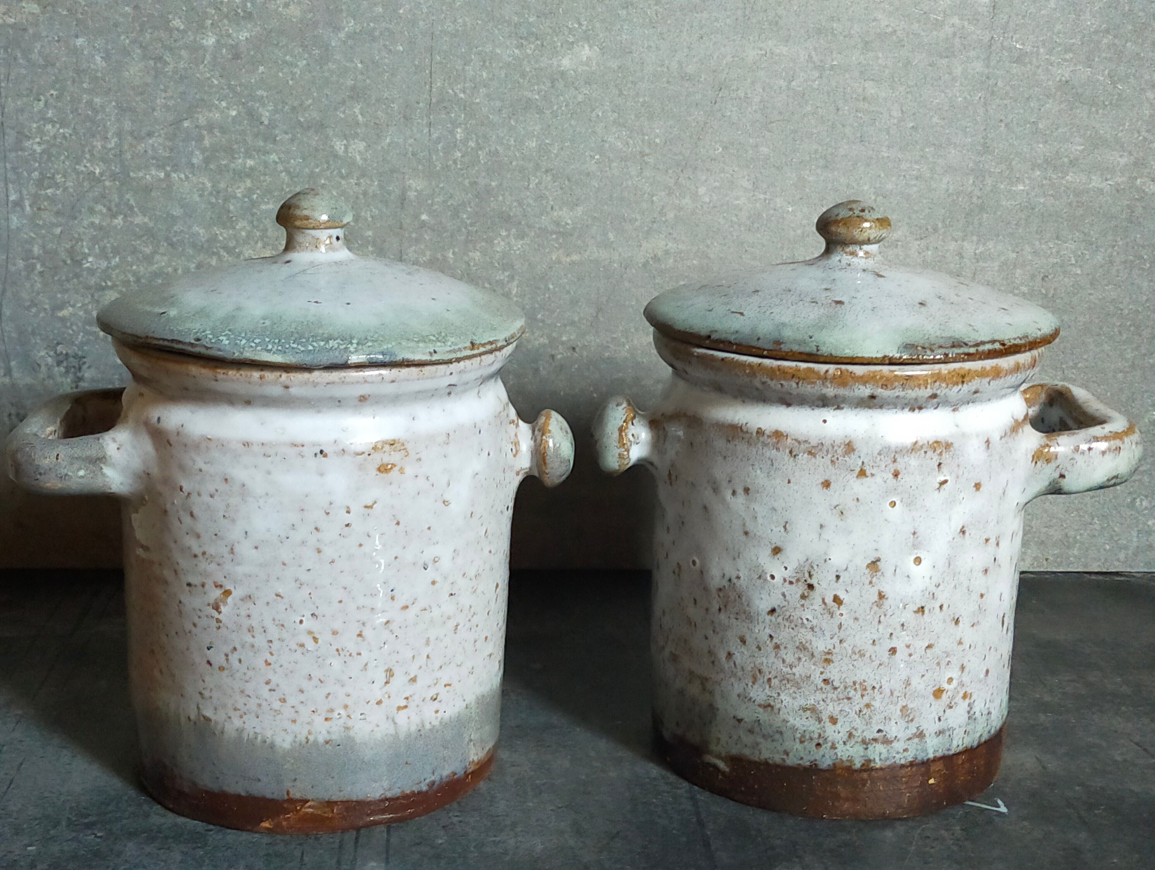 Duo of potter's pots covered in vintage glazed stoneware