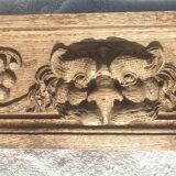 Carved wooden pediment with bunches of grapes