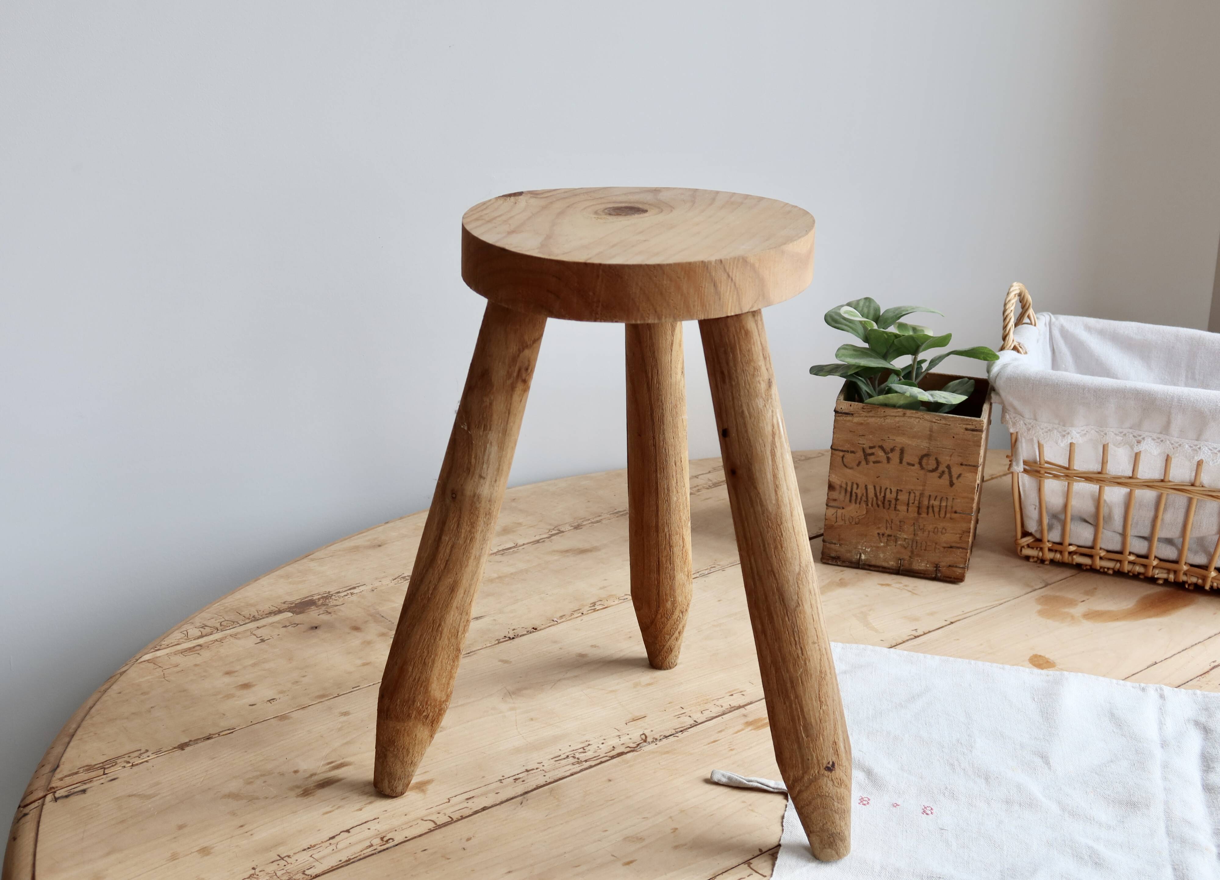 Vintage tripod stool in light raw wood