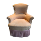 Fauteuil crapaud velours jaune et passementerie rose