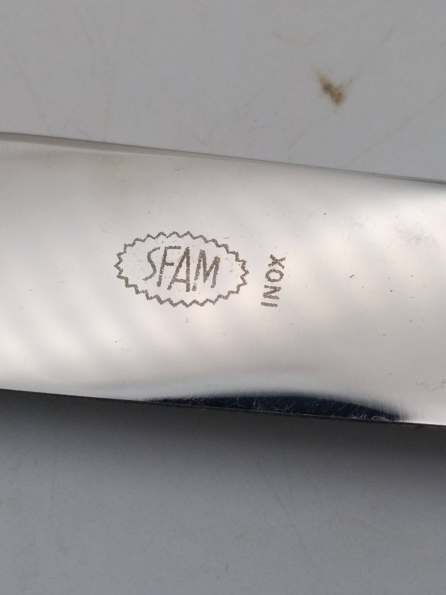 Set of 12 sfam knives in silver metal and stainless steel blades.
