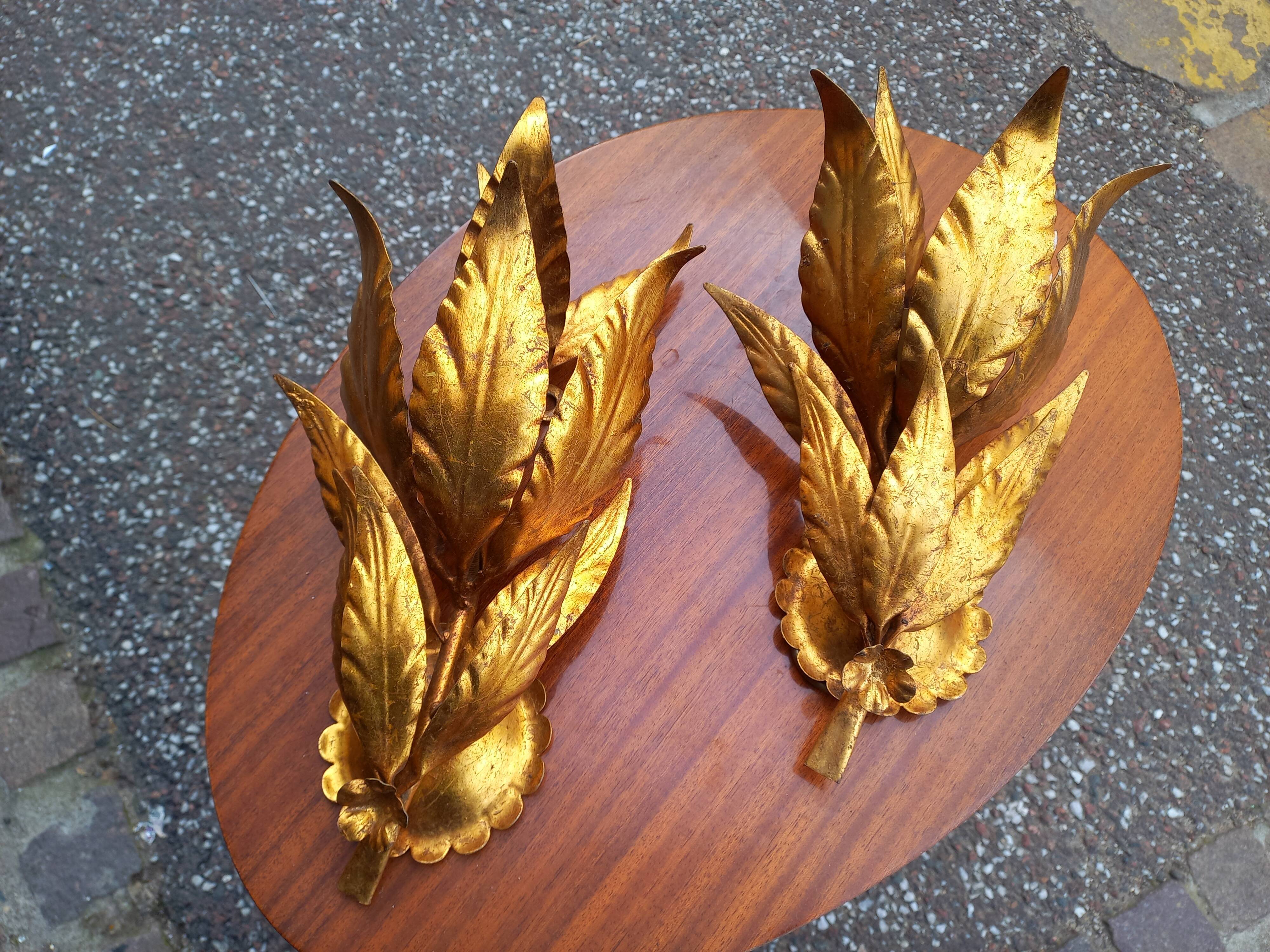 Pair of gold leaf sconces