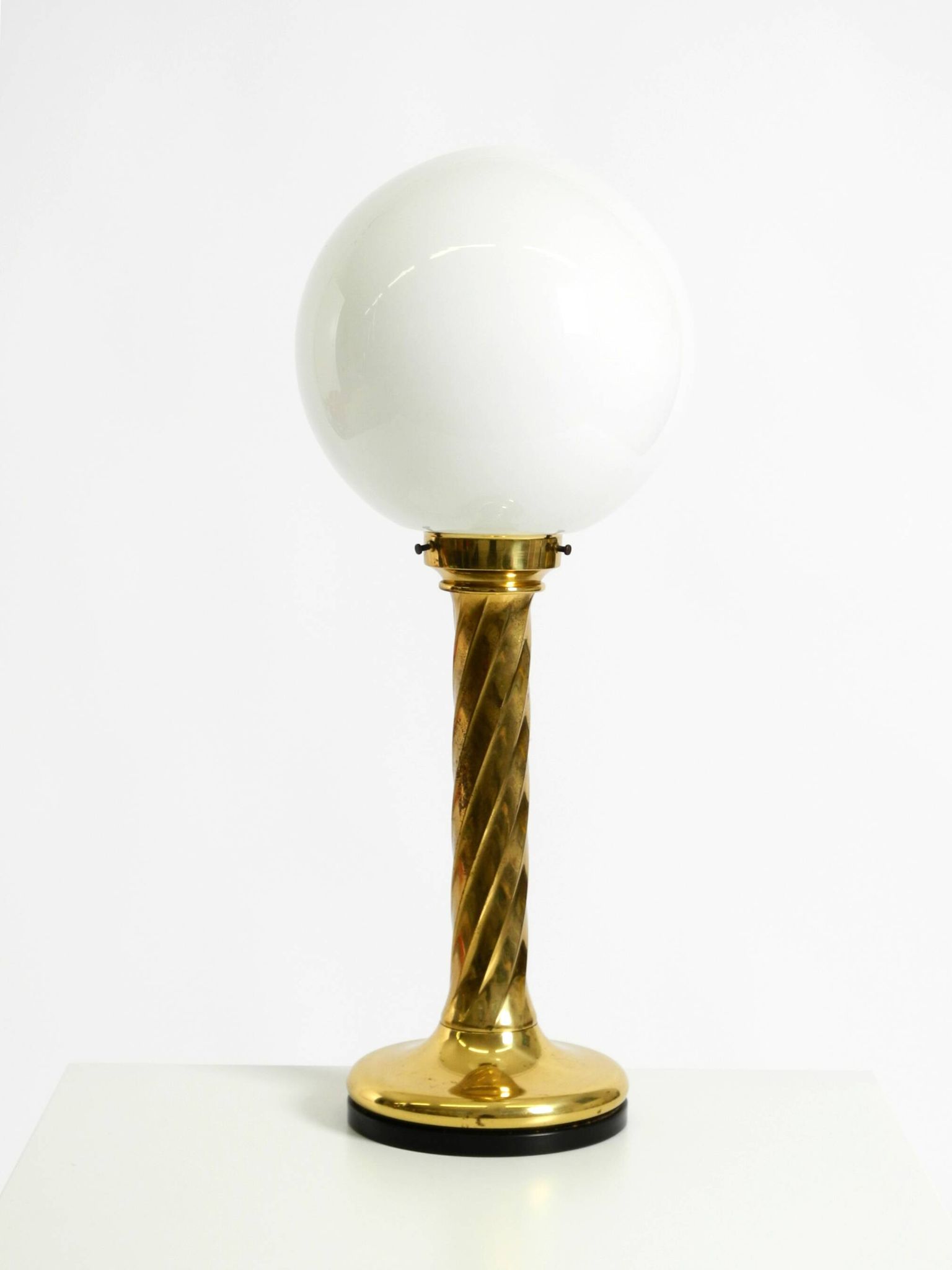 Large 1960s brass column-style table lamp with frosted glass globe
