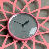 Pink Karlsson wall clock in a mid century shape