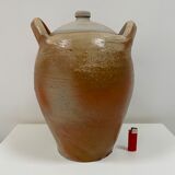 Ancient jar in varnished sandstone