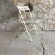 Vintage perforated metal folding chair