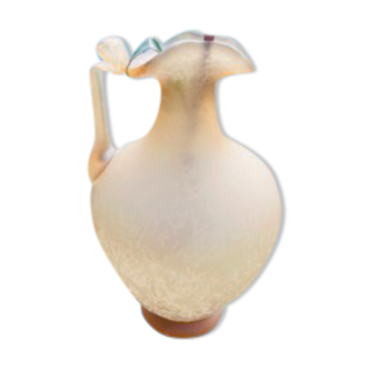 Old decorative carafe in li-colored glass