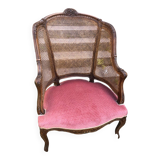 Louis XV style walnut and cane armchair