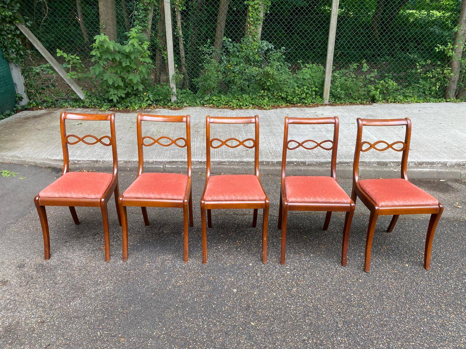 4 dining chairs made of solid wood and pink velvet fabric from the 1950s.
