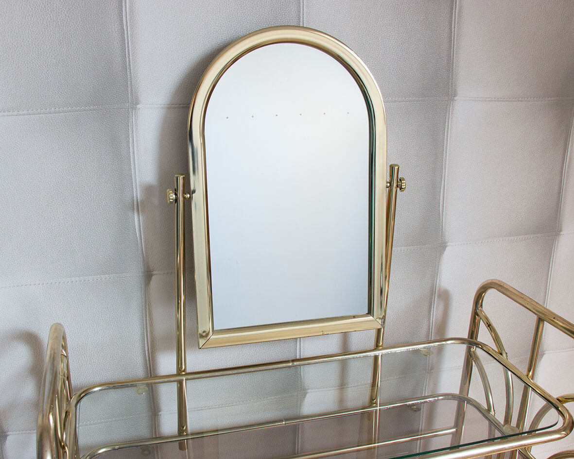Dressing table in gold metal