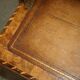 Antique George II bureau from 1740 in walnut, rosewood, and leather.