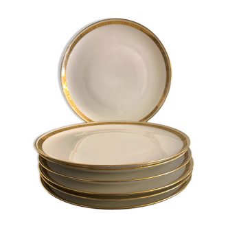 7 flat plates in porcelain of Limoges Bernardaud, decoration of golden Greek, XXth century