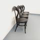 Set of 4 vintage Mouette chairs by Baumann in black wood from the 1960s.