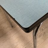 Blue formica table and its 4 chairs