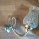 Wall light with golden metal tulip support, pockmarked glass