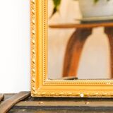 Vintage rectangular gilt mirror, molded wooden frame with beads and fire