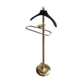 Neoclassical style valet stand in brass and black lacquered wood. French work. Circa 1940