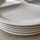 5 vintage beige fondue plates Le Creuset