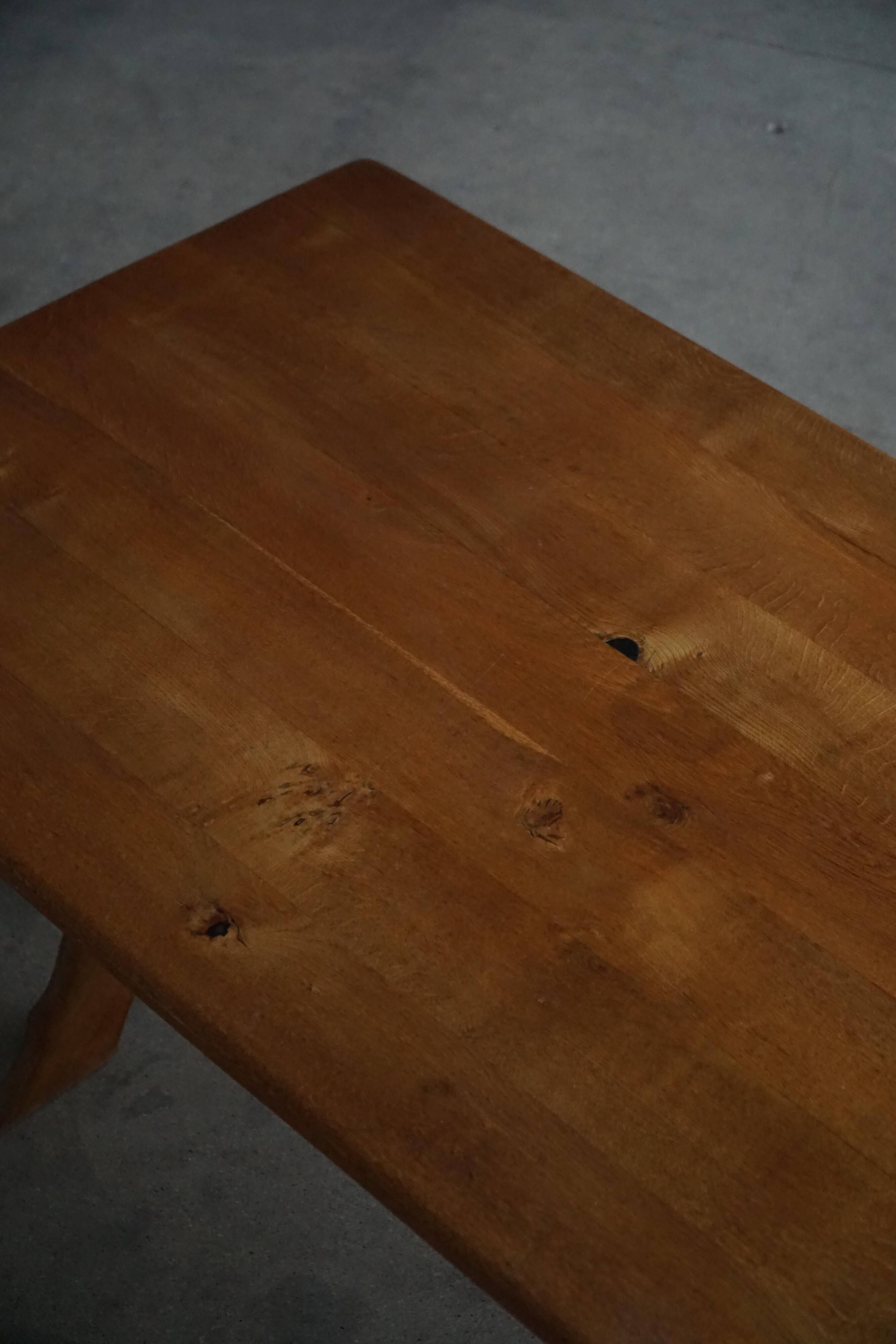Solid oak dining table with cross base by Danish cabinetmaker, mid-20th century.