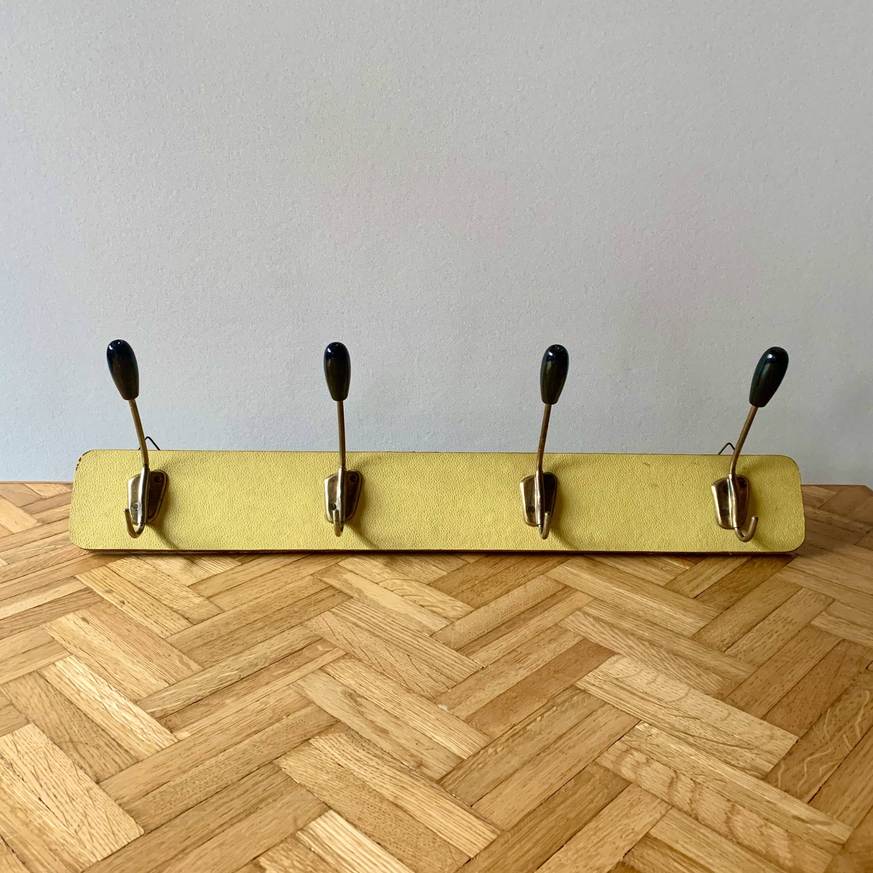 Vintage yellow wall coat rack - four hooks - 1950s