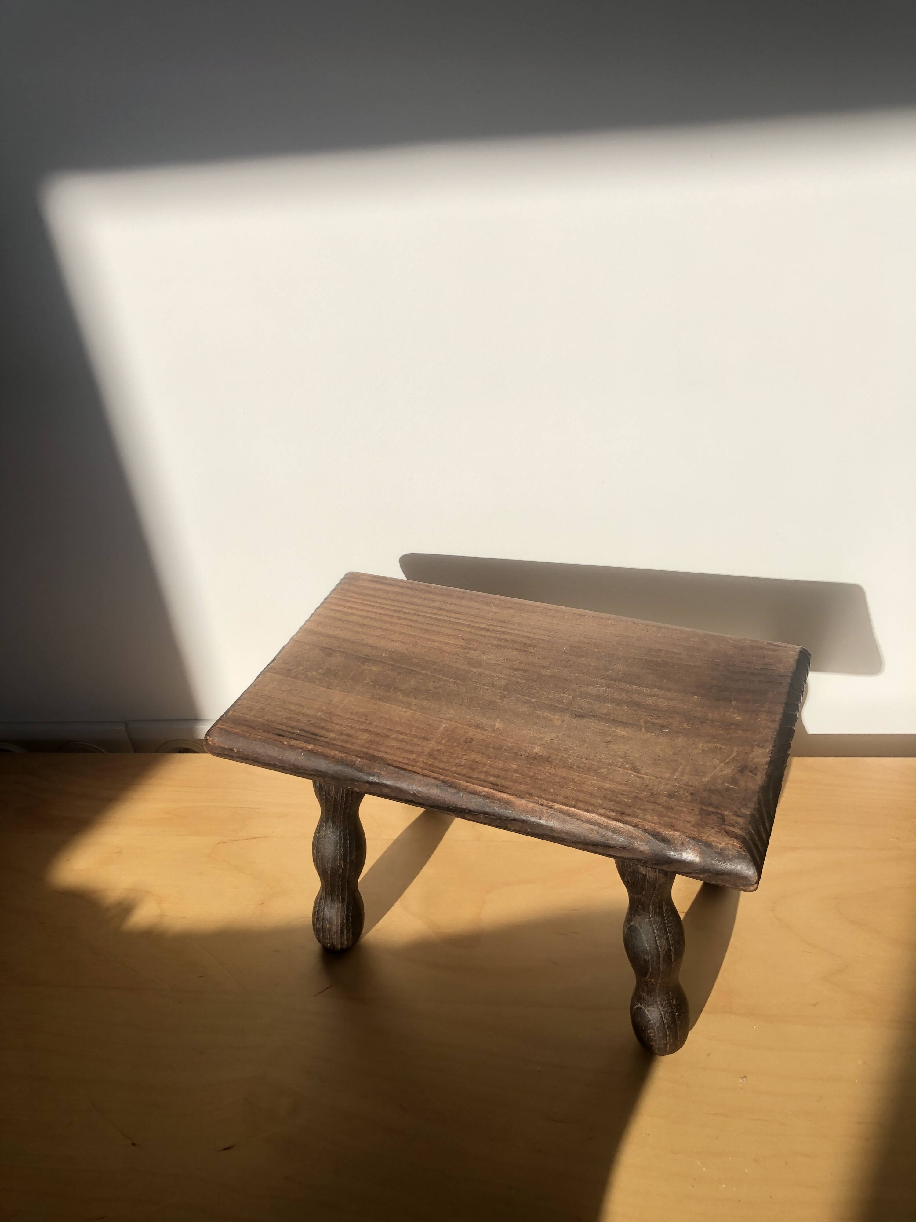 Small wooden bench with beaded legs