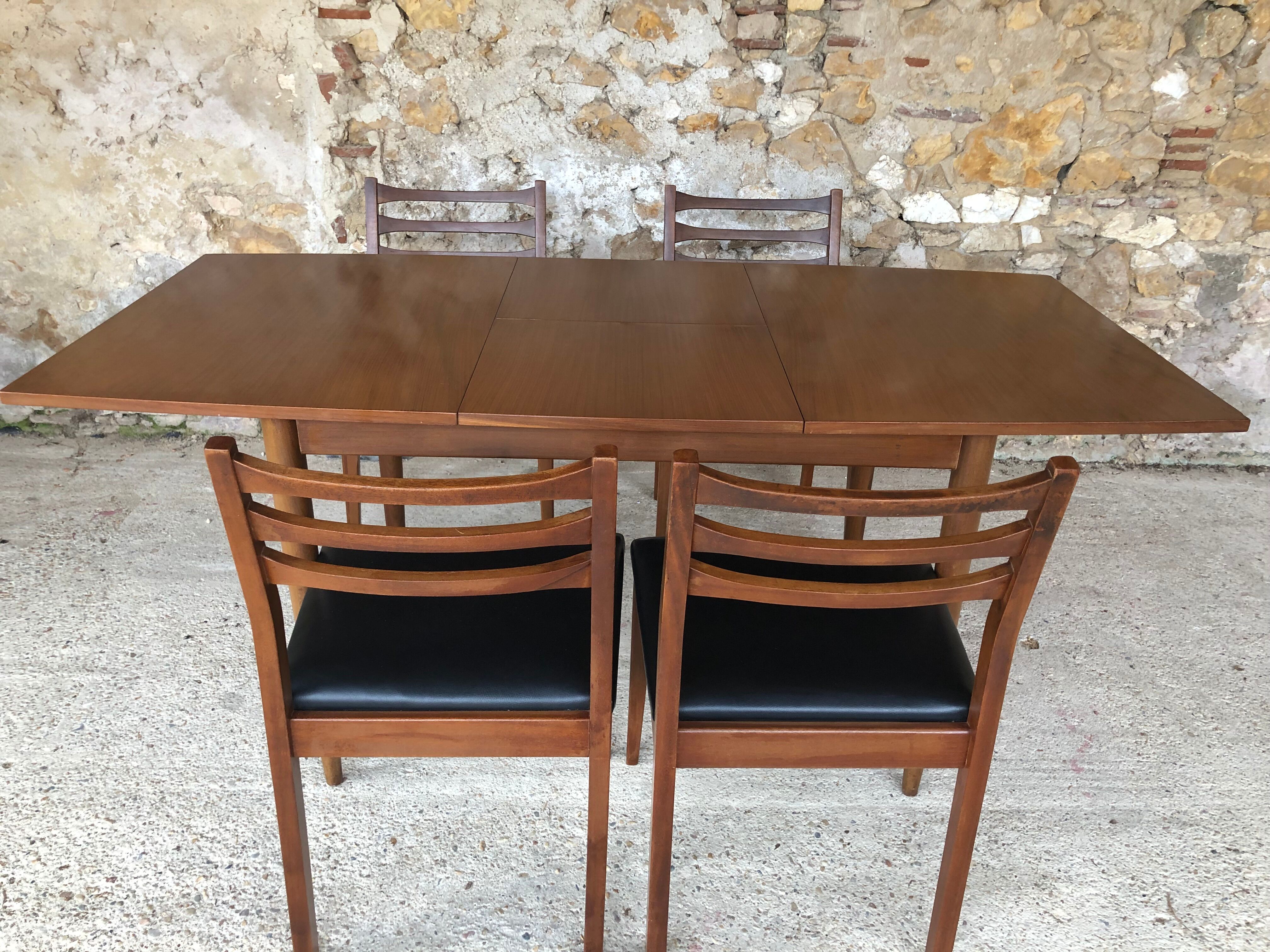 Scandinavian extension teak stretch table in butterfly ephardt by Meredew circa 60's