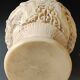 Asian-inspired ball vase. In beige cinnabar lacquer. Scenes of life decor. Arabesque and floral friezes. Height 24 cm