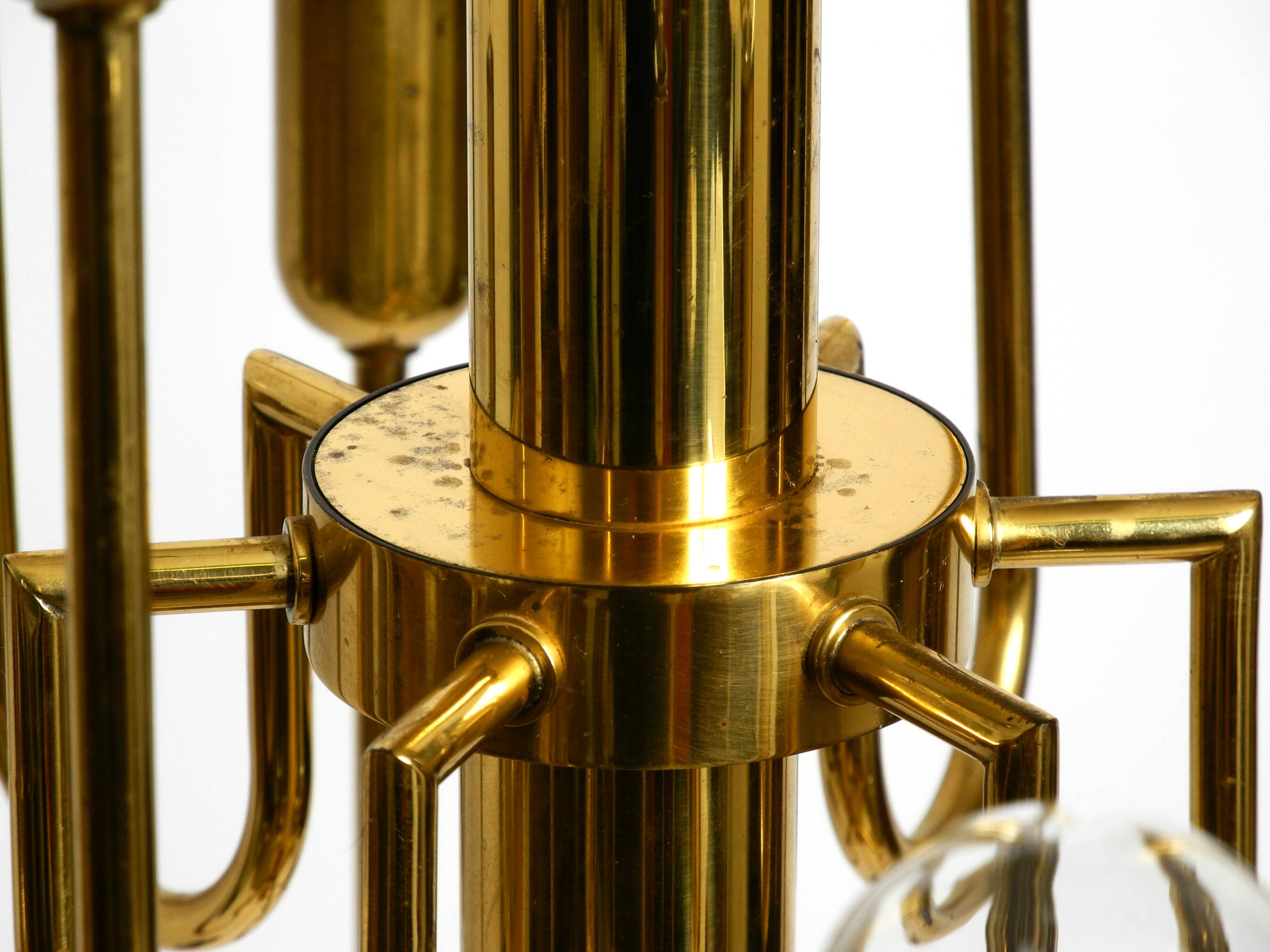 Three staged 18 arm Mid Century brass chandelier with a long brass rod