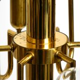 Three staged 18 arm Mid Century brass chandelier with a long brass rod