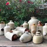 Old vinaigrier in sandstone vintage pot