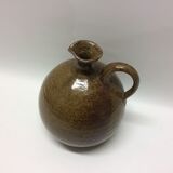 Jar in sandstone with a handle