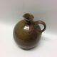 Jar in sandstone with a handle