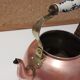 Vintage kettle in pink copper, brass and ceramic