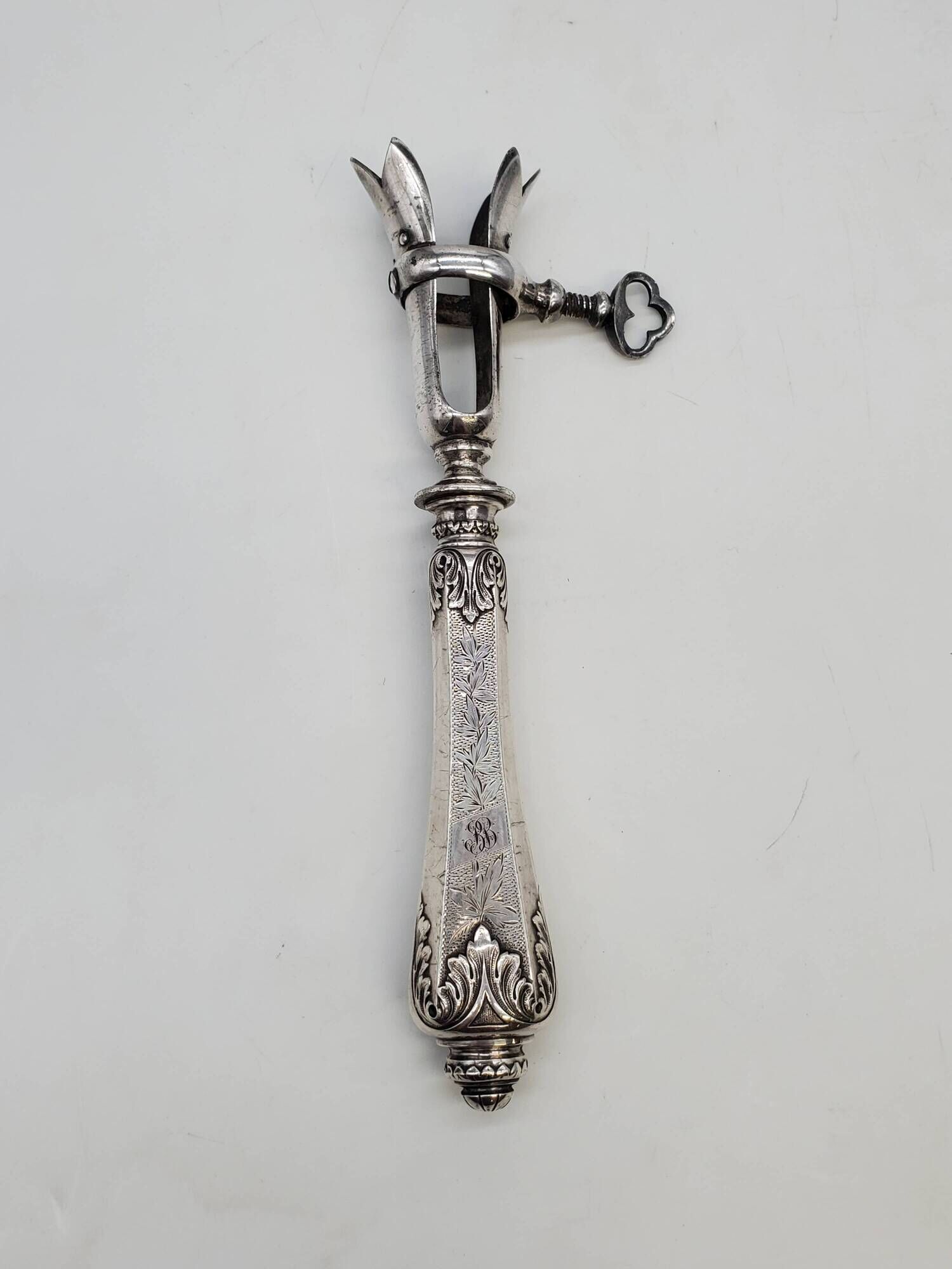 Set of serving forks and silver-plated leg of lamb fork.