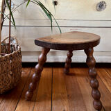 Low vintage wooden tripod stool