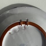 Artesania Alvarez Spanish plate in terracotta with blue plant motif.