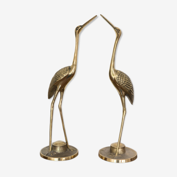 Herons in brass