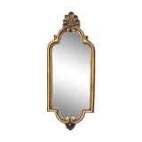 Old small wall mirror in golden resin