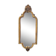Old small wall mirror in golden resin